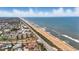 Breathtaking aerial view of beachfront properties along the scenic coastline, highlighting the property's prime location at 3180 Ocean Shore Blvd # 407, Ormond Beach, FL 32176