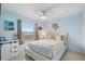 Charming bedroom features stylish nautical decor and a comfortable bed at 3180 Ocean Shore Blvd # 407, Ormond Beach, FL 32176
