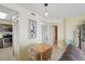 Cozy dining area features a drop leaf table, beach-themed decor, and convenient access to kitchen and bath at 3180 Ocean Shore Blvd # 407, Ormond Beach, FL 32176