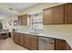 Well-equipped kitchen with ample storage, stainless steel dishwasher, and plenty of natural light at 3180 Ocean Shore Blvd # 407, Ormond Beach, FL 32176