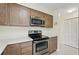 Updated kitchen features stainless appliances, bright countertops, and lots of cabinet space at 3180 Ocean Shore Blvd # 407, Ormond Beach, FL 32176