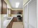 Updated kitchen featuring stainless steel appliances, modern lighting, and lots of cabinet space at 3180 Ocean Shore Blvd # 407, Ormond Beach, FL 32176