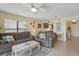 Inviting living room with comfortable seating, coastal decor, and seamless flow into the adjacent dining and kitchen areas at 3180 Ocean Shore Blvd # 407, Ormond Beach, FL 32176