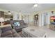 Comfortable living room with an open concept layout featuring a kitchen view and a peaceful atmosphere at 3180 Ocean Shore Blvd # 407, Ormond Beach, FL 32176