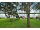 Beautiful backyard featuring large shade tree and dock at 320 Lakeview St # 208, Orlando, FL 32804