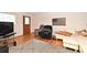 Inviting living room featuring hardwood floors, a comfortable couch, a cozy armchair, and an American flag art piece at 320 Lakeview St # 208, Orlando, FL 32804