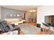 Comfortable living room with a plush white couch, modern area rug, and neutral tones providing a cozy atmosphere at 320 Lakeview St # 208, Orlando, FL 32804