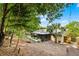 An expansive backyard with lush trees and an enclosed patio space at 327 Ketch Ct, Orlando, FL 32835
