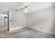 Bright bedroom includes an overhead fan and a partial view of the kitchen at 327 Ketch Ct, Orlando, FL 32835