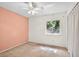 The bedroom features a window view and a ceiling fan for comfort at 327 Ketch Ct, Orlando, FL 32835