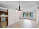 Open dining area featuring tile floors and is well-lit; an ideal space for entertaining at 327 Ketch Ct, Orlando, FL 32835