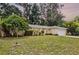 Charming single-story home with a well-maintained lawn and beautiful landscaping at 327 Ketch Ct, Orlando, FL 32835