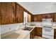 Functional kitchen featuring wood cabinets, ample counter space, and white appliances; ready for everyday cooking at 327 Ketch Ct, Orlando, FL 32835