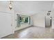Bright living room with tile floors, a large window, and a neutral color palette offering a cozy feel at 327 Ketch Ct, Orlando, FL 32835