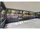 A spacious screened patio, with views of the landscaped backyard at 327 Ketch Ct, Orlando, FL 32835