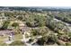 A scenic aerial view showing a well-situated home nestled among mature trees and green lawns at 35724 Dawn Dr, Leesburg, FL 34788