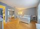 Bedroom featuring hard wood floors, mirrored closet doors and gray walls at 35724 Dawn Dr, Leesburg, FL 34788