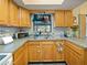 Well-maintained kitchen featuring ample countertop space and wooden cabinetry at 35724 Dawn Dr, Leesburg, FL 34788