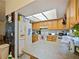 Functional kitchen featuring light wood cabinets and a bright, airy atmosphere with a skylight at 35724 Dawn Dr, Leesburg, FL 34788
