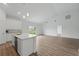 Bright and airy living space with modern kitchen, an island, and an open layout at 459 Cinnamon Dr, Kissimmee, FL 34759