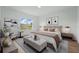 Comfortable main bedroom featuring ample natural light, stylish decor, and a serene atmosphere at 459 Cinnamon Dr, Kissimmee, FL 34759
