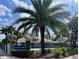 Community entrance featuring the Huntley Park sign, lush landscaping, and a decorative wrought iron fence at 4652 Oak Arbor Cir, Orlando, FL 32808