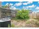 View of the backyard with a screened-in patio and mature landscaping at 468 Wexdon Ct, Lake Mary, FL 32746