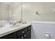 Bathroom with a single sink vanity, a large mirror, and decorative accents at 468 Wexdon Ct, Lake Mary, FL 32746
