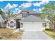 Two-story home with a two car garage and neutral colored exterior at 468 Wexdon Ct, Lake Mary, FL 32746