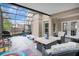Enclosed patio featuring an outdoor table with seating and access to the backyard at 468 Wexdon Ct, Lake Mary, FL 32746