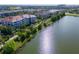 Aerial view of the building and complex situated next to a tranquil lake at 4816 Cayview Ave # 20111, Orlando, FL 32819