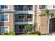 Close-up of apartment building exterior with multiple balconies and well-maintained landscaping at 4816 Cayview Ave # 20111, Orlando, FL 32819