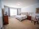 Bright bedroom with large window, dresser, and classic furnishings at 4816 Cayview Ave # 20111, Orlando, FL 32819