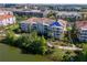 Aerial view of the building with view of roof damage tarped for repair at 4816 Cayview Ave # 20111, Orlando, FL 32819