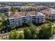 Aerial view of the building with view of roof damage tarped for repair at 4816 Cayview Ave # 20111, Orlando, FL 32819