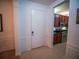 Entryway with tile floors and a view into the kitchen with stainless steel appliances at 4816 Cayview Ave # 20111, Orlando, FL 32819