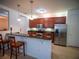 Modern kitchen featuring stainless steel appliances and a breakfast bar at 4816 Cayview Ave # 20111, Orlando, FL 32819