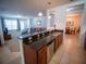 Open-concept kitchen with granite countertops and views of the living and dining areas at 4816 Cayview Ave # 20111, Orlando, FL 32819