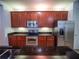 Stylish kitchen with stainless steel appliances, granite countertops, and ample cabinetry at 4816 Cayview Ave # 20111, Orlando, FL 32819