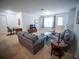 Spacious living room with comfortable seating, television, and ample natural light at 4816 Cayview Ave # 20111, Orlando, FL 32819