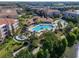 Aerial view of the resort-style community pool with splash area, surrounded by lush landscaping at 4816 Cayview Ave # 20111, Orlando, FL 32819