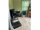 Inviting office space with modern desk, wood floors and a calming zen-like atmosphere at 4843 Pierce Arrow Dr, Apopka, FL 32712