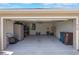 Spacious two car garage featuring ample storage space and overhead lighting at 490 Pentas Ln, Haines City, FL 33844