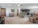 Inviting living room seamlessly connects to the kitchen, offering an open and airy layout for modern living at 490 Pentas Ln, Haines City, FL 33844