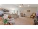 Inviting living room seamlessly connects to the kitchen, offering an open and airy layout for modern living at 490 Pentas Ln, Haines City, FL 33844