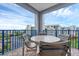 Covered balcony with blue railing, and outdoor seating at 5300 S Atlantic Ave # 5507, New Smyrna Beach, FL 32169
