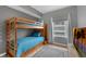 Bedroom with bunk beds and a large window offering natural light and city views at 5300 S Atlantic Ave # 5507, New Smyrna Beach, FL 32169