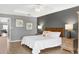 Bright bedroom features a queen size bed, wooden furniture, and decor at 5300 S Atlantic Ave # 5507, New Smyrna Beach, FL 32169