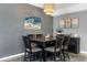 Dining room showcases a rustic wood table, seating for six, colorful rug and attractive wall art at 5300 S Atlantic Ave # 5507, New Smyrna Beach, FL 32169