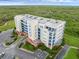 Aerial view of condo building featuring multiple stories and balcony at 5300 S Atlantic Ave # 5507, New Smyrna Beach, FL 32169